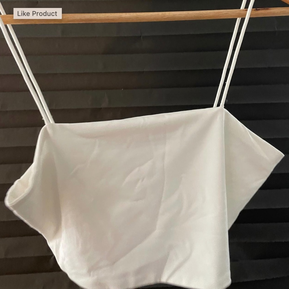 A white crop top, very short